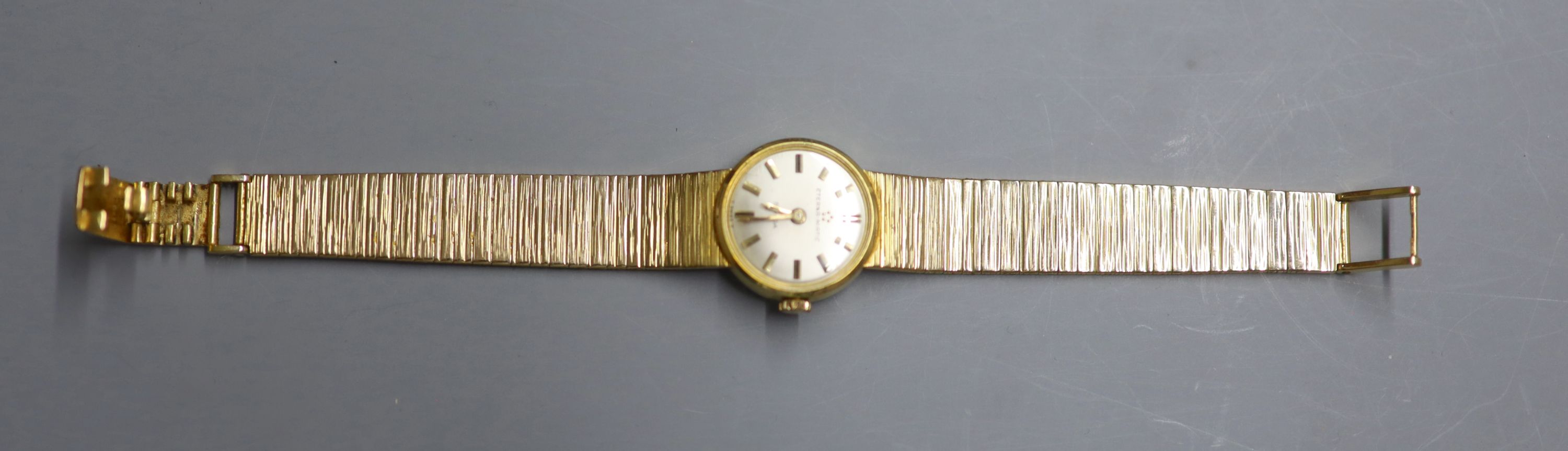 A ladys 9ct gold Eterna-Matic manual wind wrist watch, on a 9ct gold bracelet, overall 16cm, gross 30.7 grams.